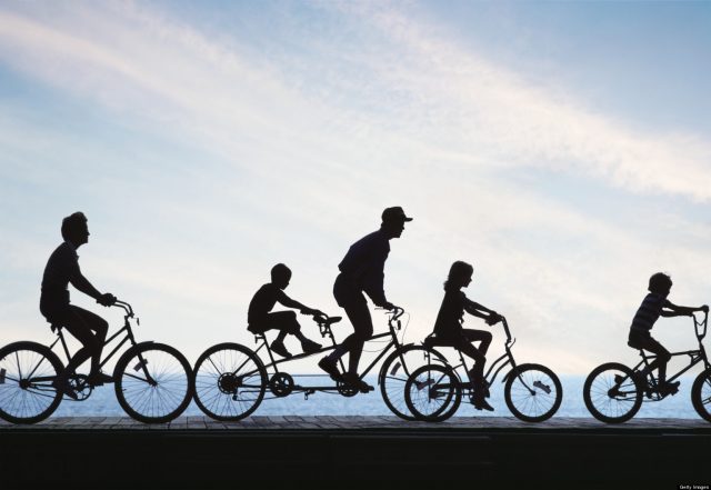 Photo of family bicycling